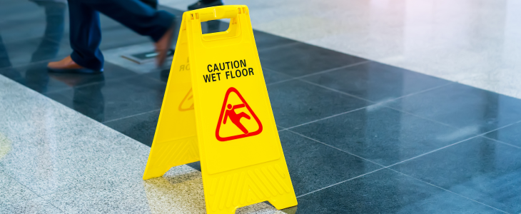 Caution wet floor sign on the floor