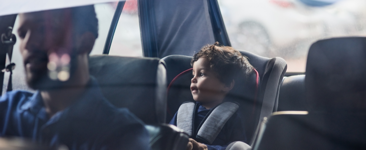 Child in the back of a car seat